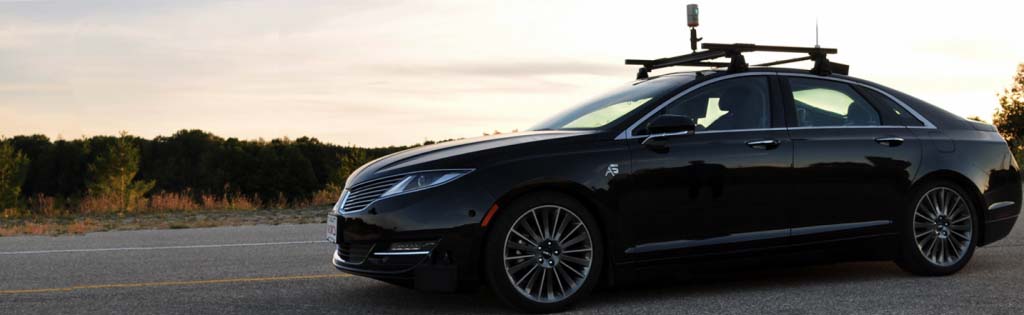 Photograph of vehicle with sunset in background