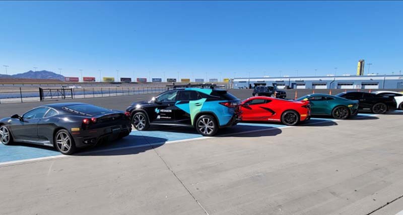 Row of cars parked at an angle include Hexagon AS branded Lexus