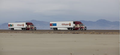 Distant view of trucks on a road